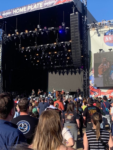 standing in the crowrd at Inning's Festival before Noah Kahan plays